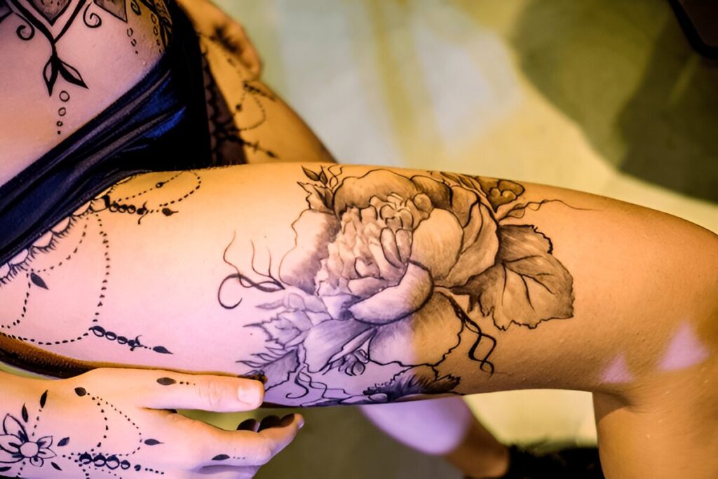 outer upper leg tattoo placement women