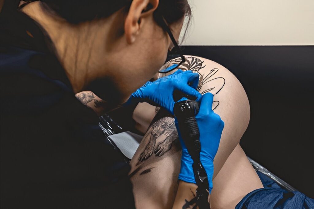 upper leg tattoo detail women