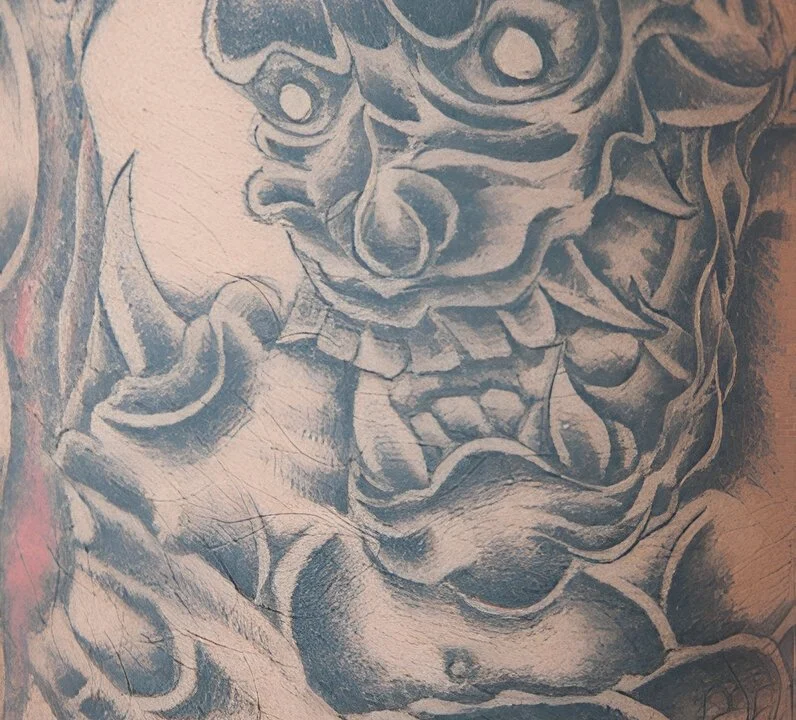 Japanese half sleeve tattoo for men featuring waves and koi design flow