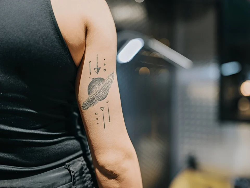 geometric mandala half sleeve tattoo idea for men with dotwork details