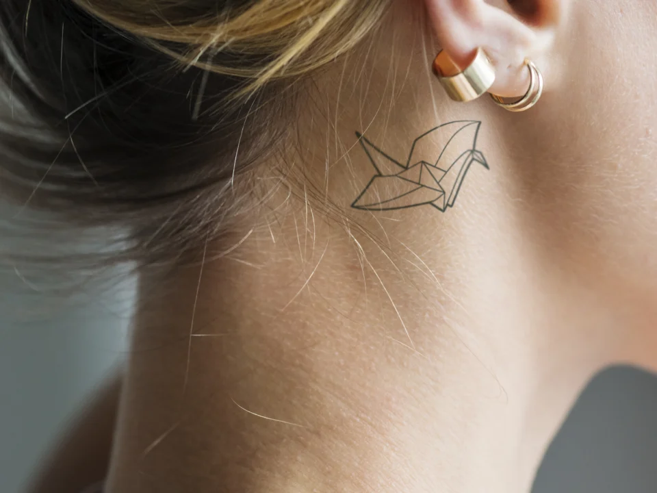 Small gap filler tattoo ideas using minimal symbols to connect larger sleeve elements seamlessly