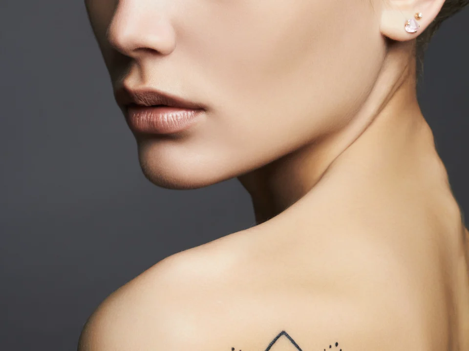 geometric shoulder tattoo filler design