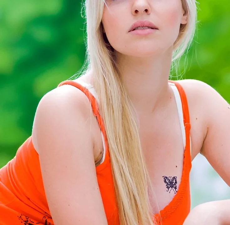 small butterfly tattoo design representing personal growth and rebirth