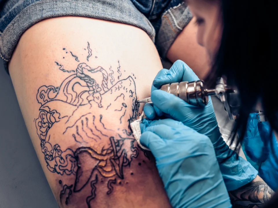 smoke style shoulder filler tattoo