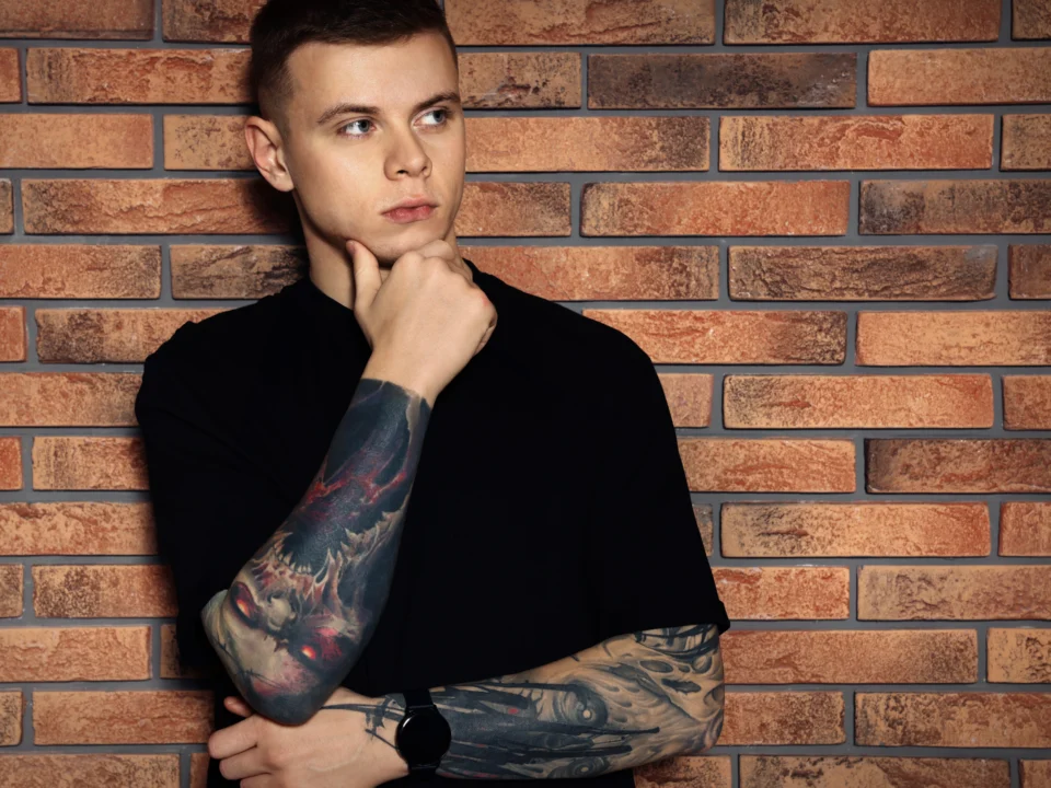 traditional forearm tattoo design skull and rose tattoo